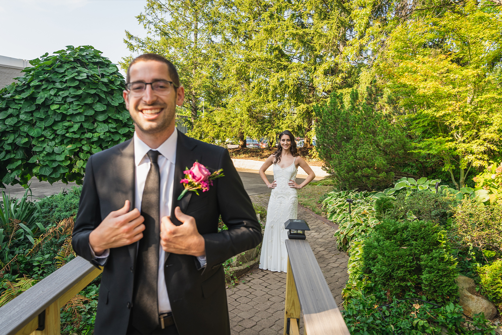 Bride and groom first look, smile, green, nature, bridge, trees, classy wedding ceremony at Landerhaven, Mayfield Heights OH