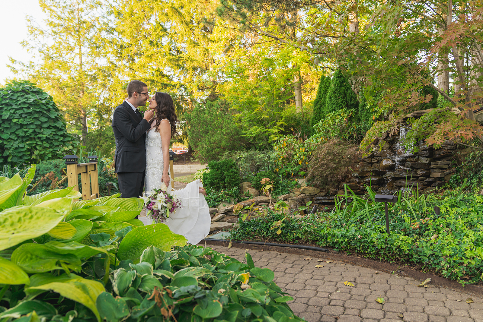 Bride and groom wedding portrait, couple portrait, cute pose, cute couple pose, cute bride and groom pose, green, nature, trees, stones, classy wedding ceremony at Landerhaven, Mayfield Heights OH