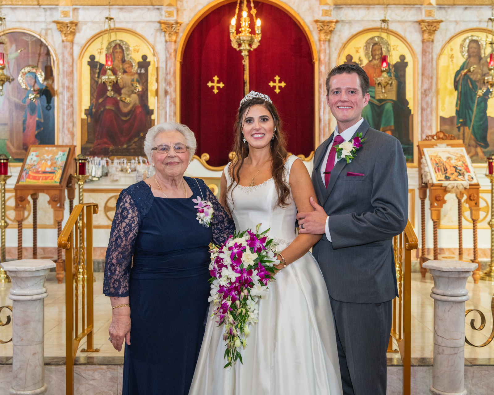 Bride and groom with family, family portrait, church, Greek Orthodox wedding, sweet wedding ceremony at Crocker Park, Westlake OH