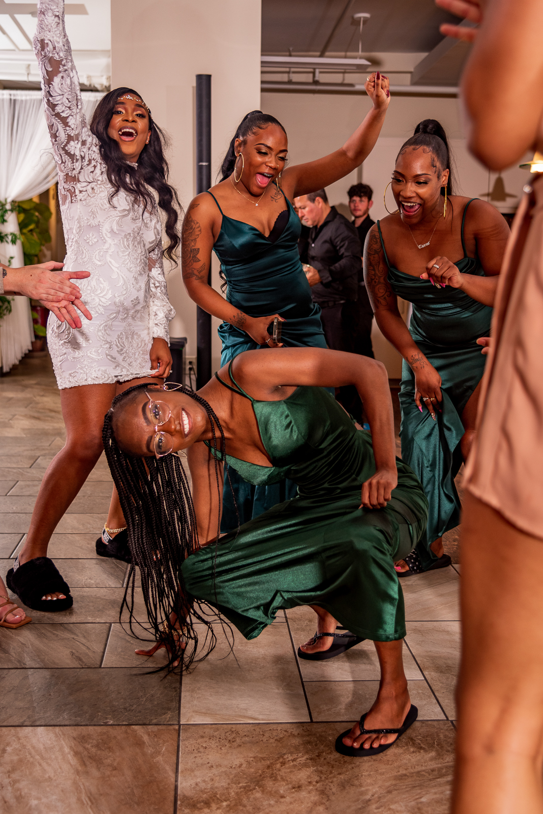 Bride with bridesmaids, dance, music, DJ, fun, African American wedding, urban wedding reception at Penthouse Events, Ohio City, Cleveland Flats
