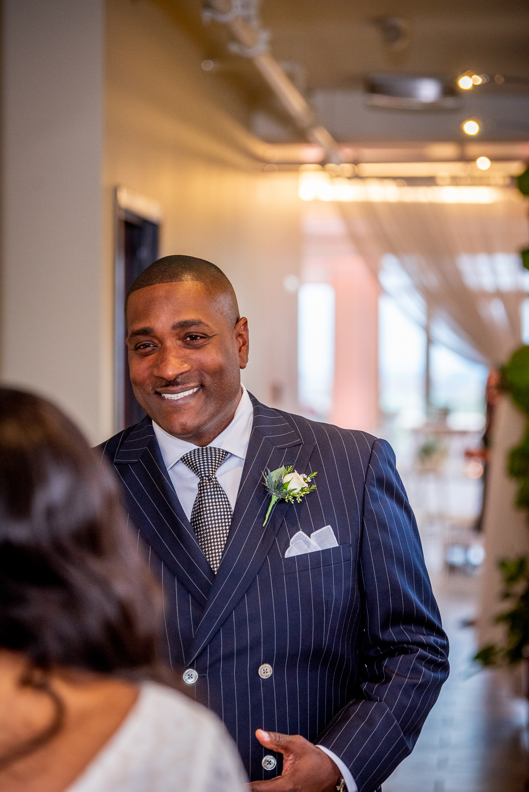 Bride with father, first look, smile, sweet, cute, pink light, pink uplighting, African American bride, African American wedding, urban wedding ceremony at Penthouse Events, Ohio City, Cleveland Flats