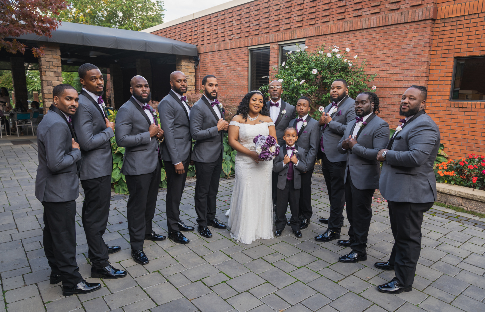 Bride with groomsmen, bridal party portrait, large bridal party, African American bride, African American wedding, romantic wedding ceremony at Hilton Akron/Fairlawn