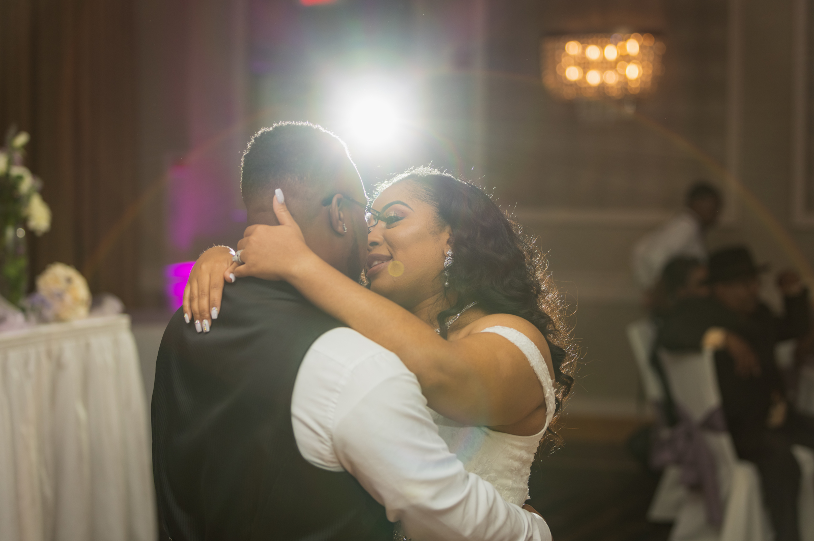 Bride and groom first dance, romantic, spotlight, unique wedding photo, beautiful African American bride, African American wedding, romantic wedding reception at Hilton Akron/Fairlawn