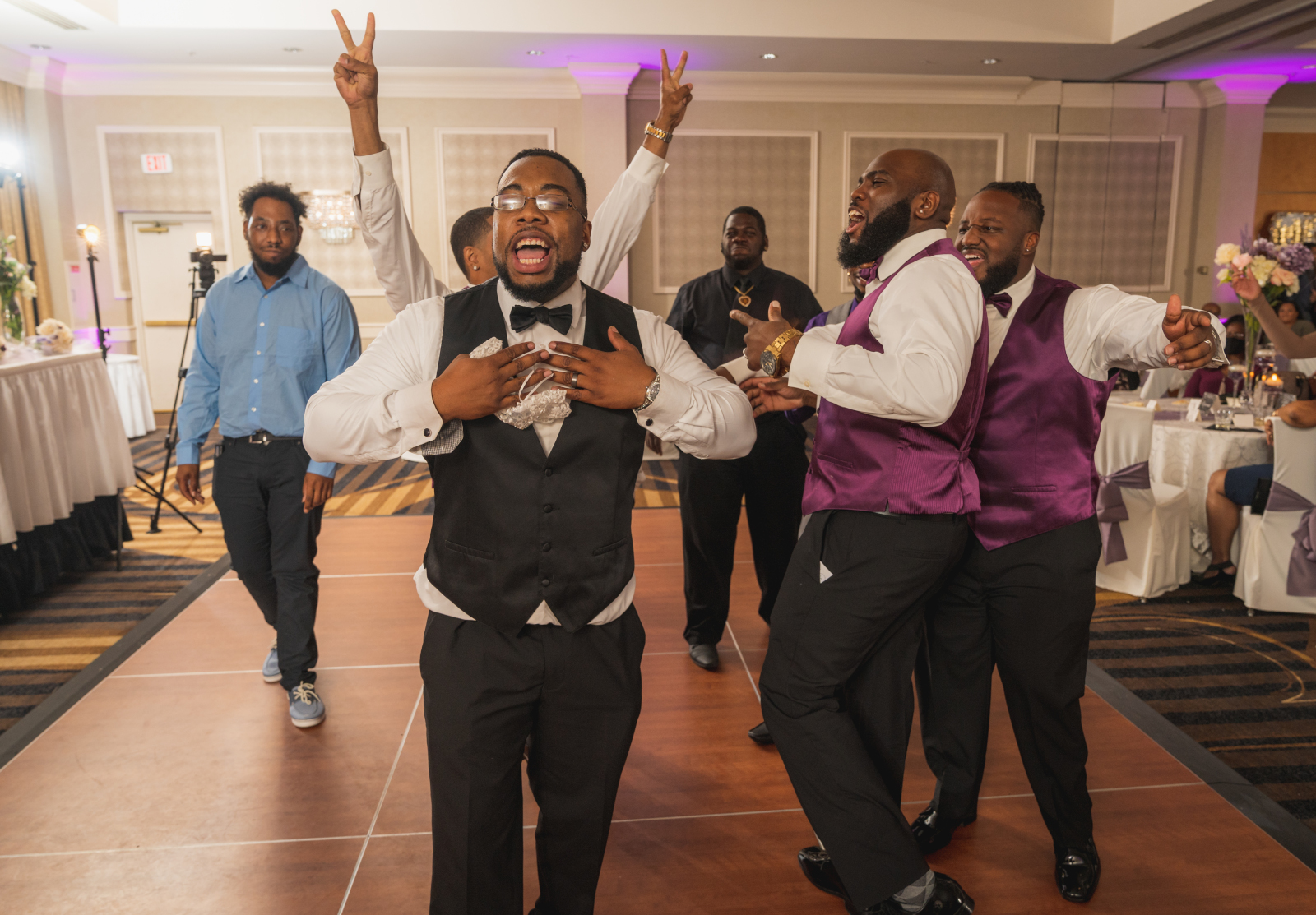 Groom and groomsmen singing, garter toss, fun wedding photo, music, wedding DJ, African American groom, African American wedding, romantic wedding reception at Hilton Akron/Fairlawn