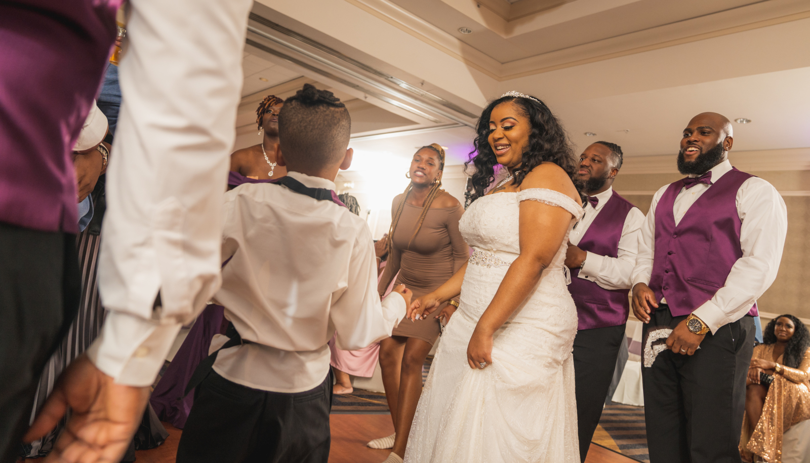 Bride smiling, dancing, candid wedding photo, African American bride, African American wedding, romantic wedding reception at Hilton Akron/Fairlawn