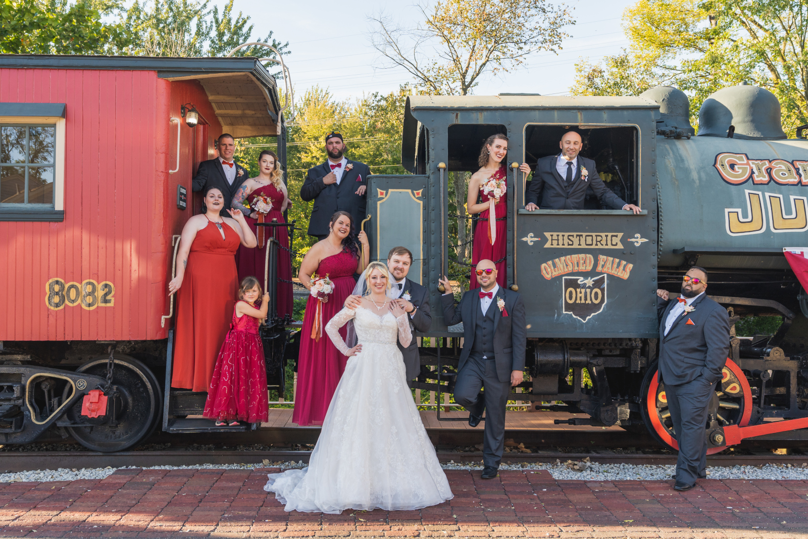 Bride and groom with bridal party, train, bridal party portrait, unique bridal party portrait, Historic Olmsted Falls Ohio, Grand Pacific Junction, fall wedding, cute outdoor wedding ceremony at Grand Pacific Wedding Gardens