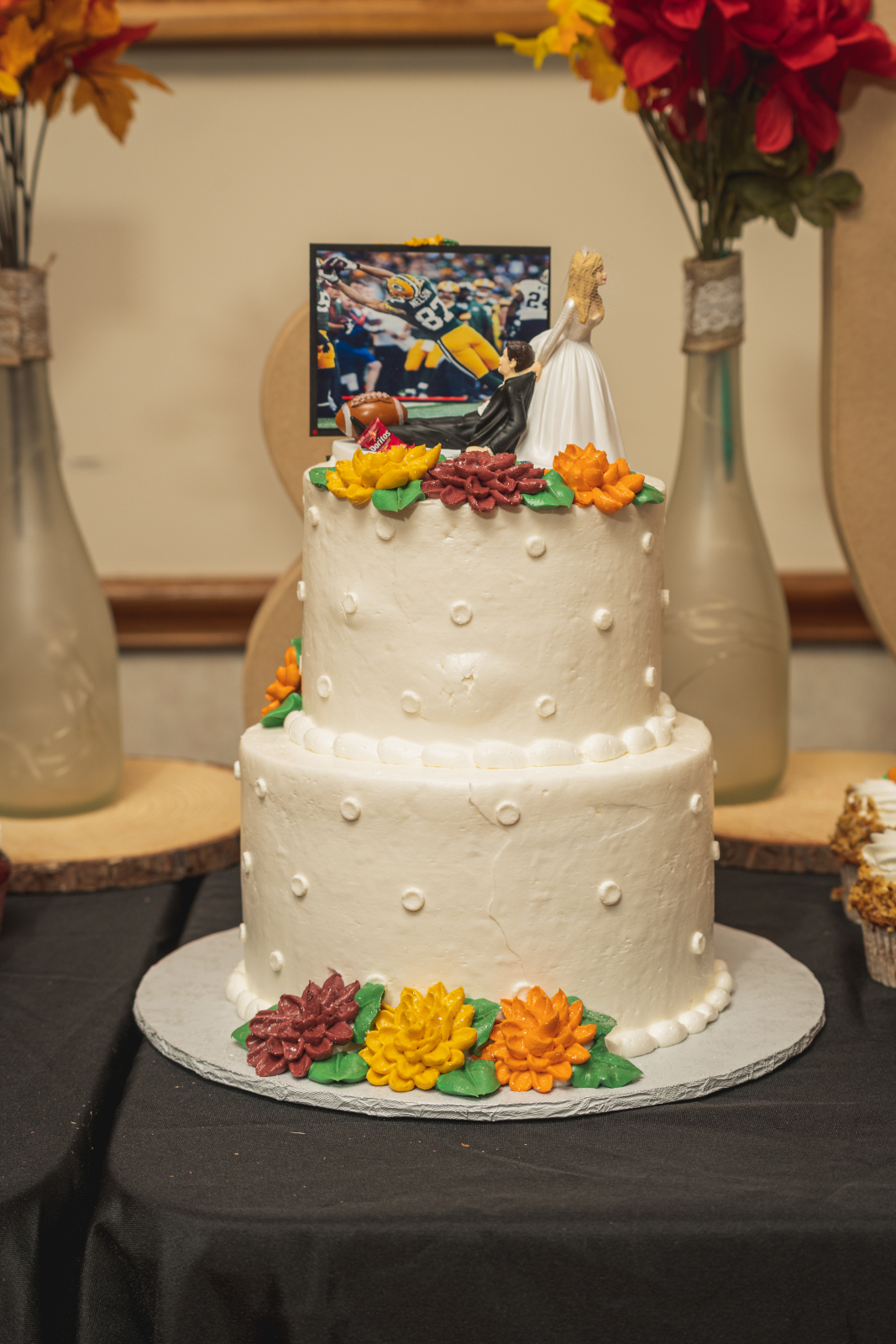 Wedding cake, fall wedding cake, orange flowers, yellow flowers, cute wedding cake, simple wedding cake, fall wedding decor, cute fall wedding reception at Grand Pacific Wedding Gardens