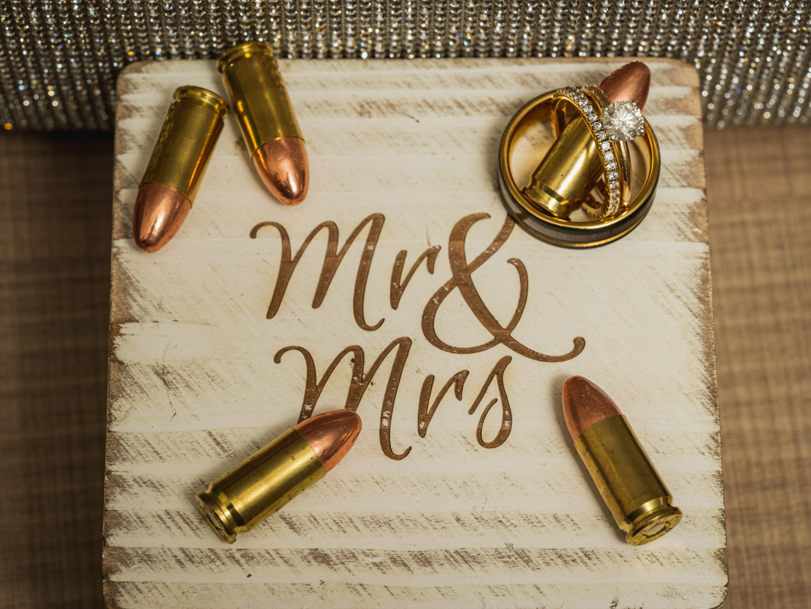 Wedding rings, bullets, wedding decor, engagement ring, wedding band, rustic, outdoor September wedding ceremony at Westfall Event Center