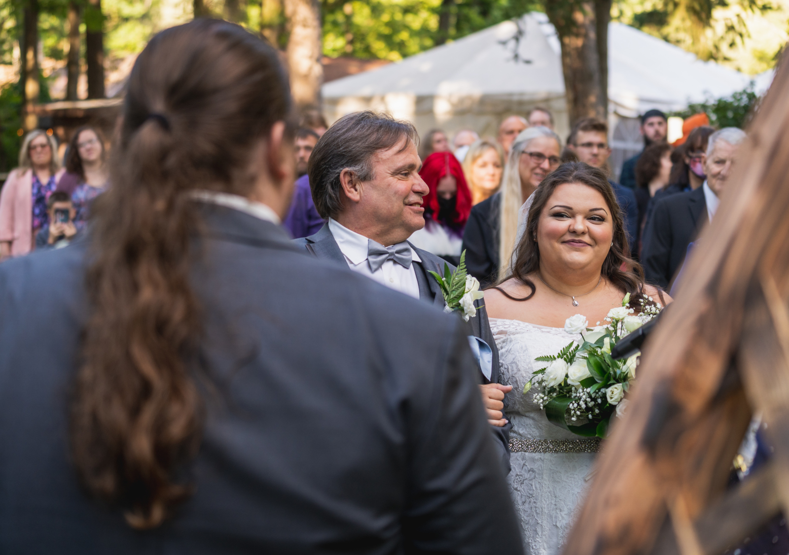 Bride with dad, father of the bride, bridal march, bridal processional, bride looking at groom, smile, outdoor September wedding ceremony at Westfall Event Center