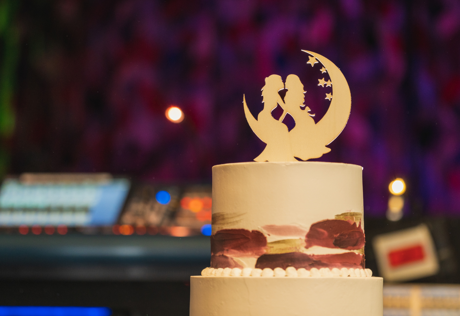 Wedding cake, cute wedding cake topper, romantic lesbian wedding cake topper, stars and moon, live sound mixing board, concert venue, rock and roll wedding, two wedding dresses, two brides, love is love, beautiful lesbian wedding reception at House of Blues Cleveland