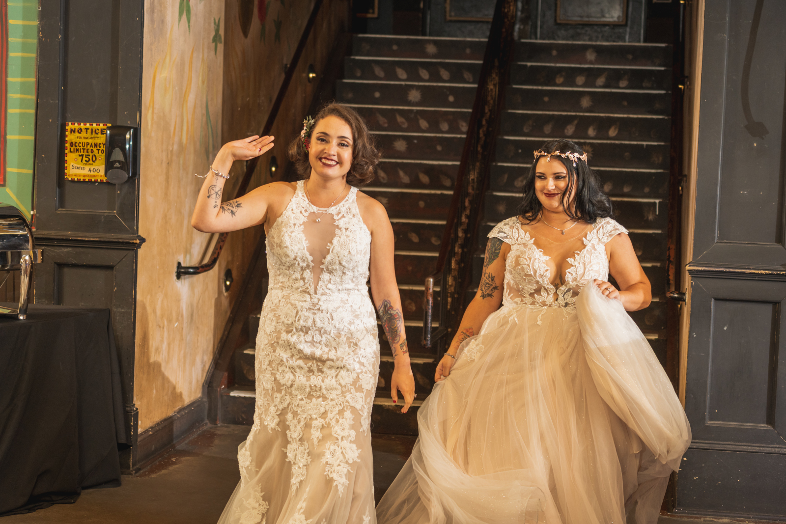 Two brides bridal party entrance, wave, smile, two wedding dresses, love is love, beautiful lesbian wedding reception at House of Blues Cleveland