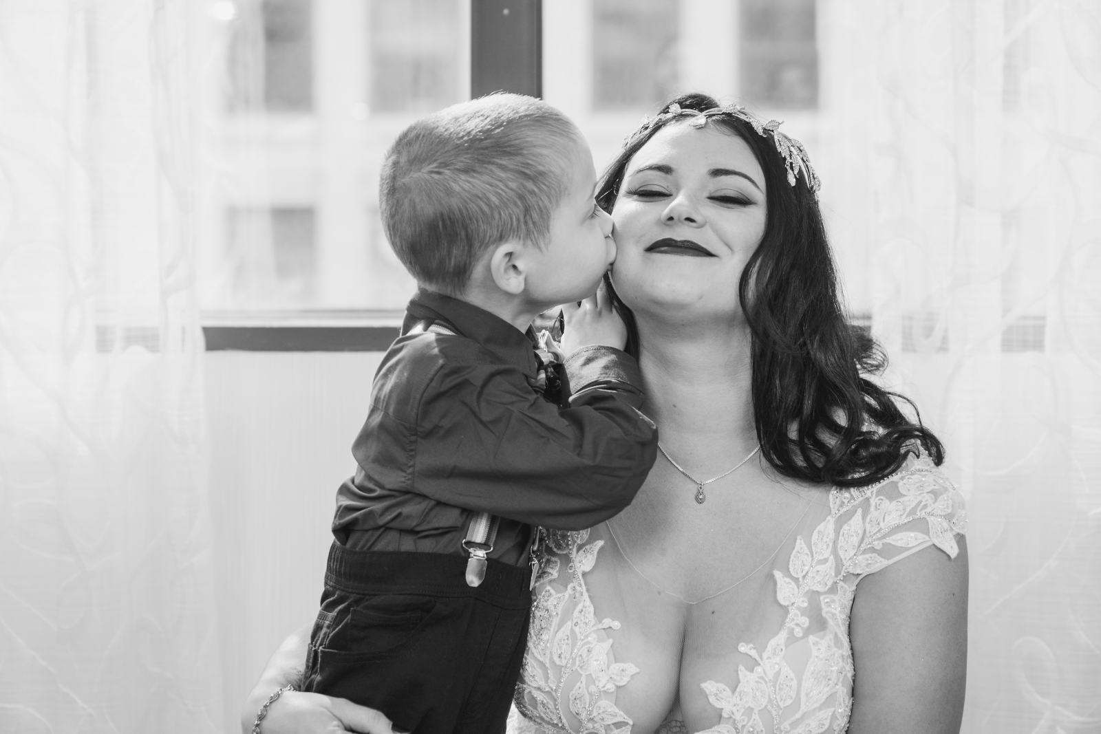 Two brides with nephew getting ready, wedding preparation, family portrait, beautiful, candid, black and white, cute, sweet, two wedding dresses, love is love, beautiful lesbian wedding at the House of Blues, Cleveland Marriott Downtown at Key Tower