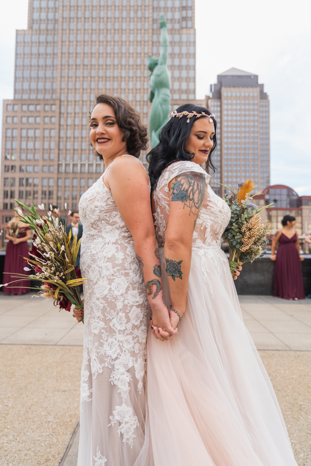 Two brides first look with bridal party, bridal party portrait, large bridal party, mixed bridal party, urban, two wedding dresses, love is love, beautiful lesbian wedding at the House of Blues, downtown Cleveland