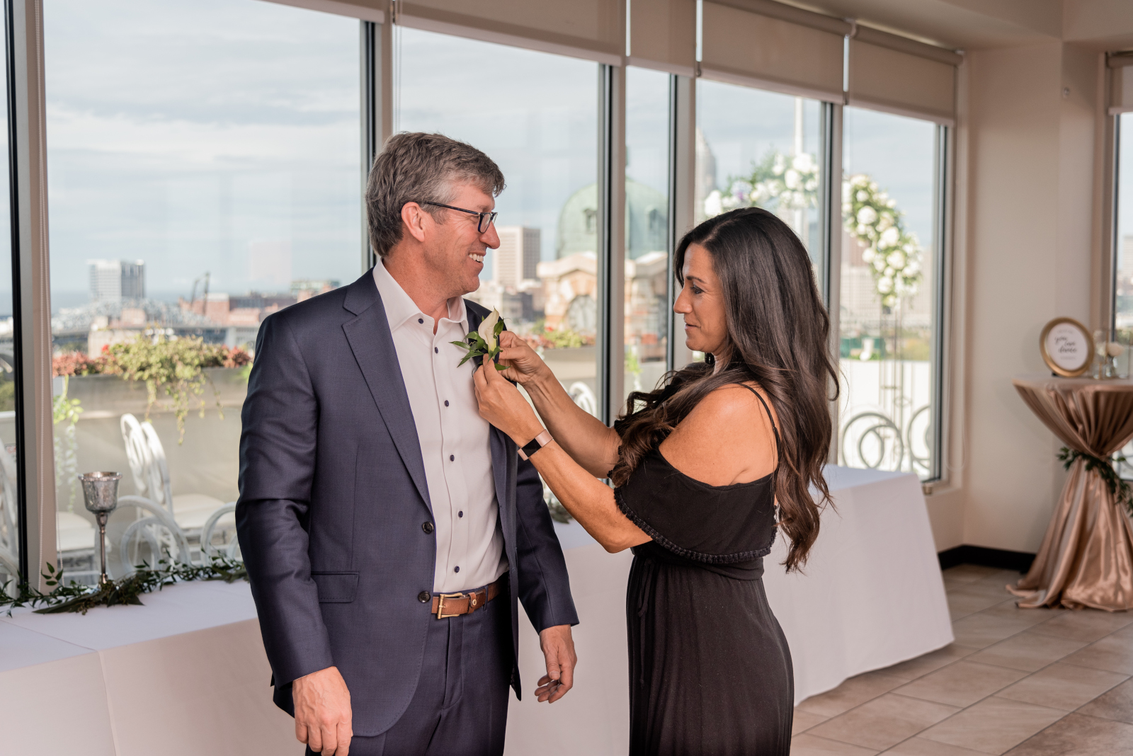 Groom getting ready, wedding preparation, candid wedding photo, smile, sweet, older groom, older couple, romantic outdoor urban wedding ceremony at Penthouse Events, Ohio City, Cleveland flats, downtown Cleveland skyline