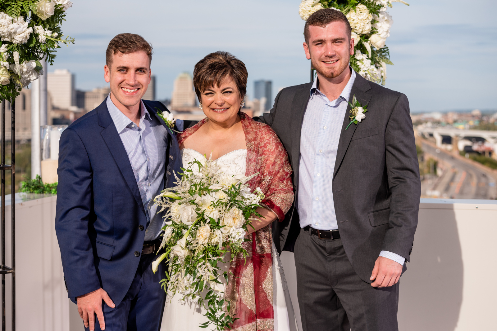 Bride with sons, groomsmen, small bridal party, bridal party portrait, older couple, romantic outdoor urban wedding ceremony at Penthouse Events, Ohio City, Cleveland Flats, downtown Cleveland skyline
