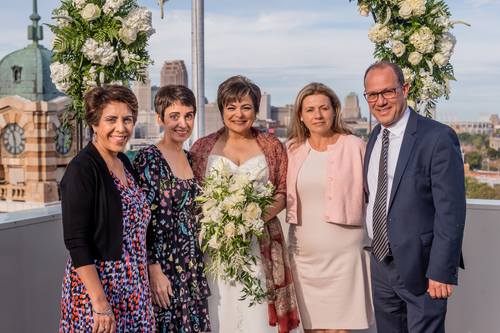 Bride with family, family portrait, older bride, older couple, romantic outdoor urban wedding ceremony at Penthouse Events, Ohio City, Cleveland Flats, downtown Cleveland skyline, West Side Market, Lake Erie