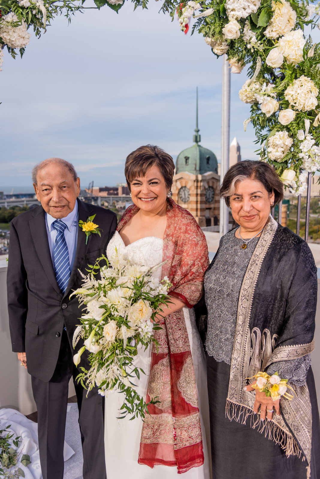 Bride with mom and dad, parents of the bride, family portrait, smile, cute wedding photo, older bride, older couple, romantic outdoor urban wedding ceremony at Penthouse Events, Ohio City, Cleveland Flats, Lake Erie, West Side Market