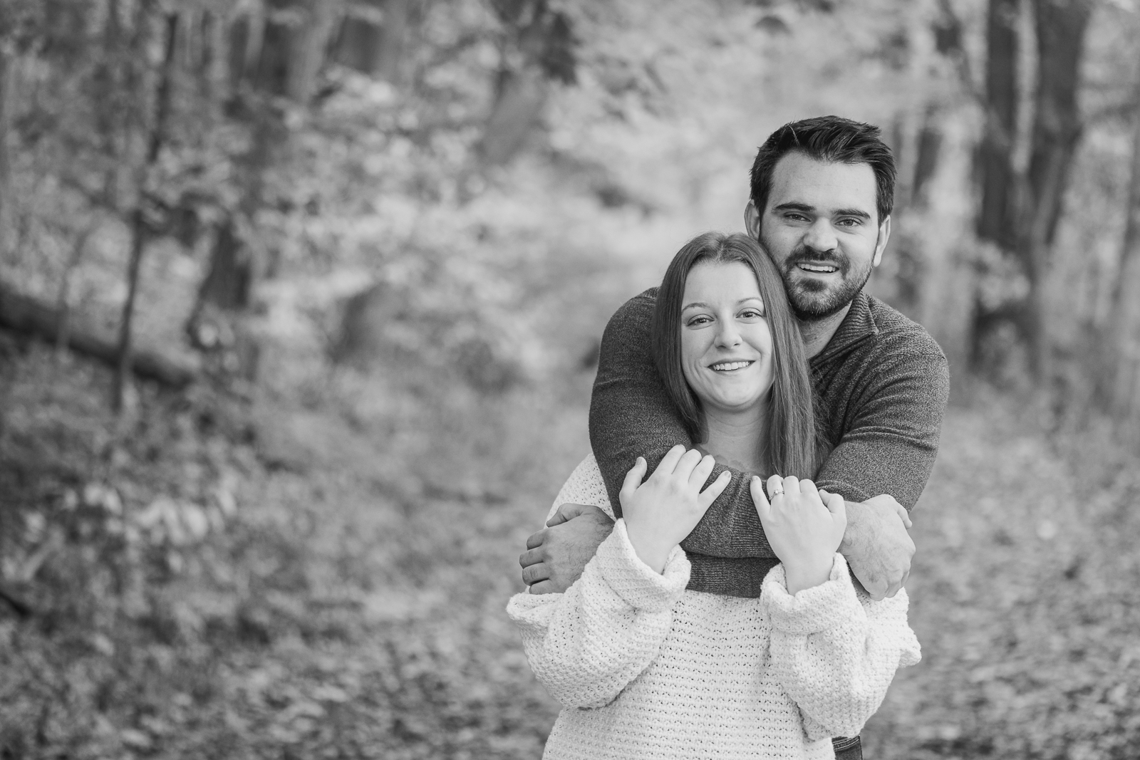 Man and woman fiancee engagement photo, couple portrait, nature, fall leaves, cute, smile, outdoor fall engagement photo session at Tinkers Creek, Bedford Reservation, Cleveland Metroparks