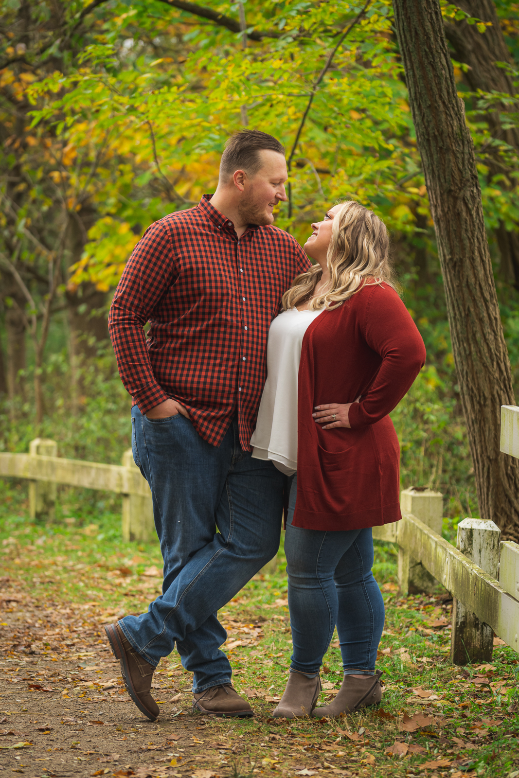 Man and woman fiancee engagement photo, outdoor fall engagement photo session at Everett Road Covered Bridge