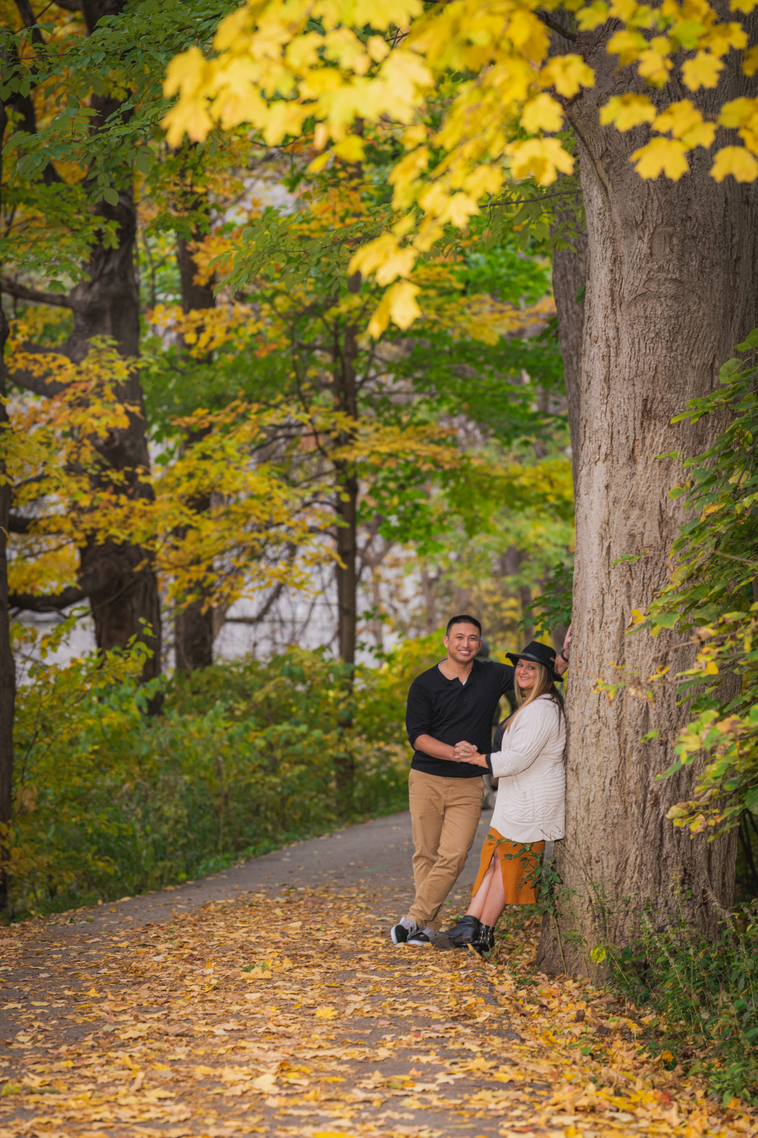 Man and woman fiancee engagement photo, outdoor fall engagement photo session at Rocky River Reservation, Cleveland Metroparks