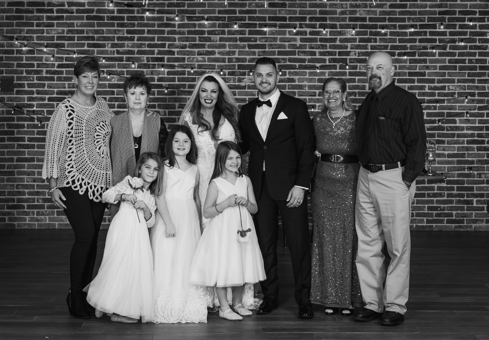 Bride and groom with family, family portrait, wedding portrait, wedding reception at Gather at the Lakes