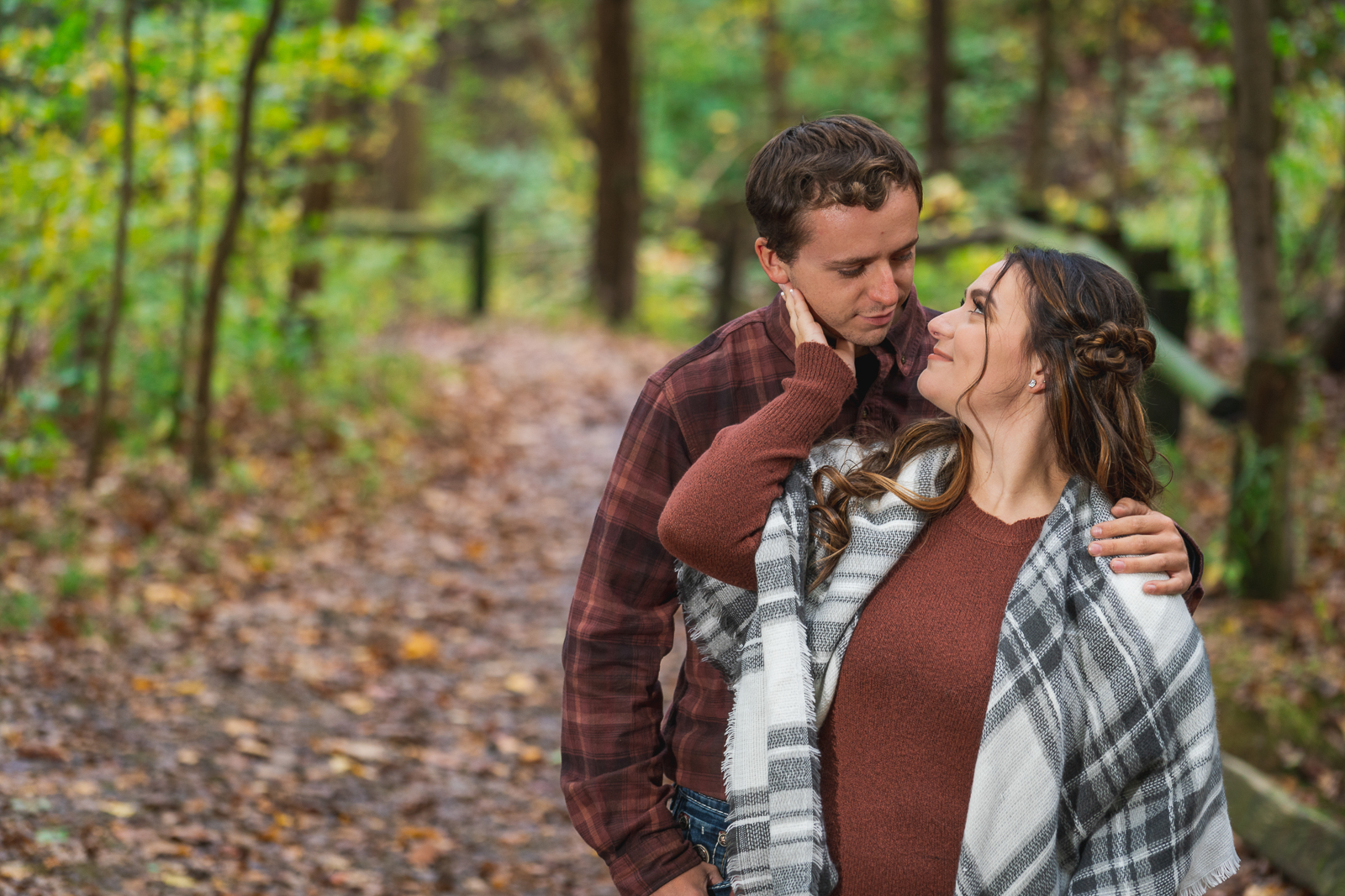 Man and woman fiancee engagement photo, outdoor fall engagement photo session at Squire's Castle, Cleveland Metroparks