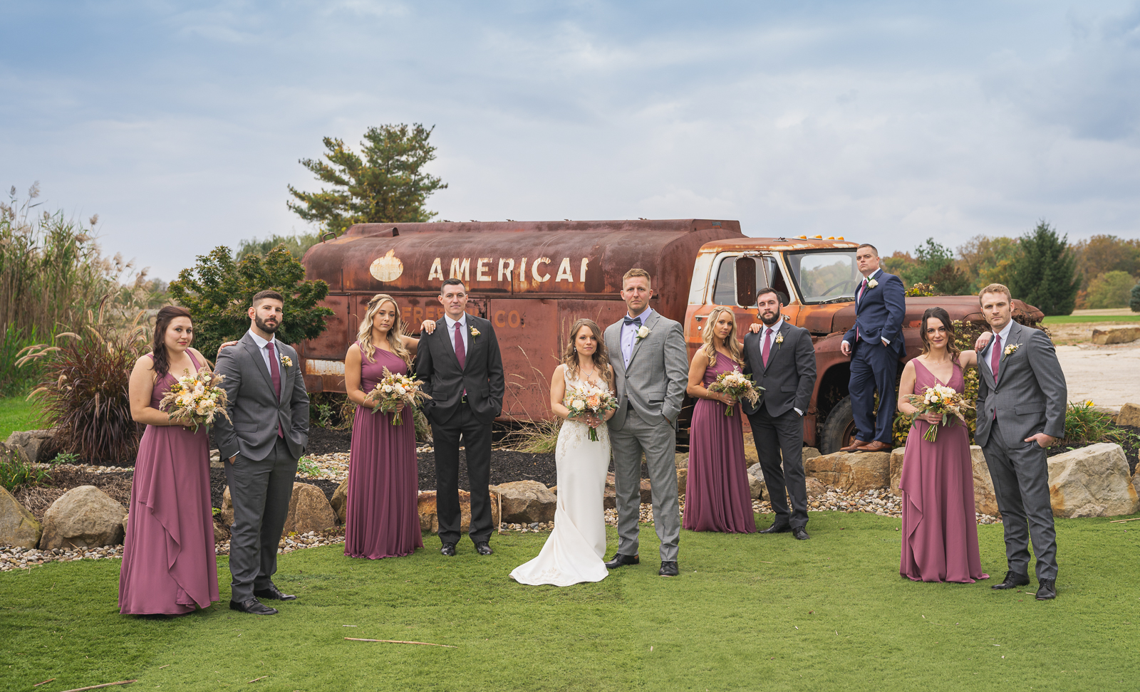 Bride and groom with bridal party, bridal party portrait, old truck, American oil, fall wedding, rustic outdoor wedding ceremony at White Birch Barn