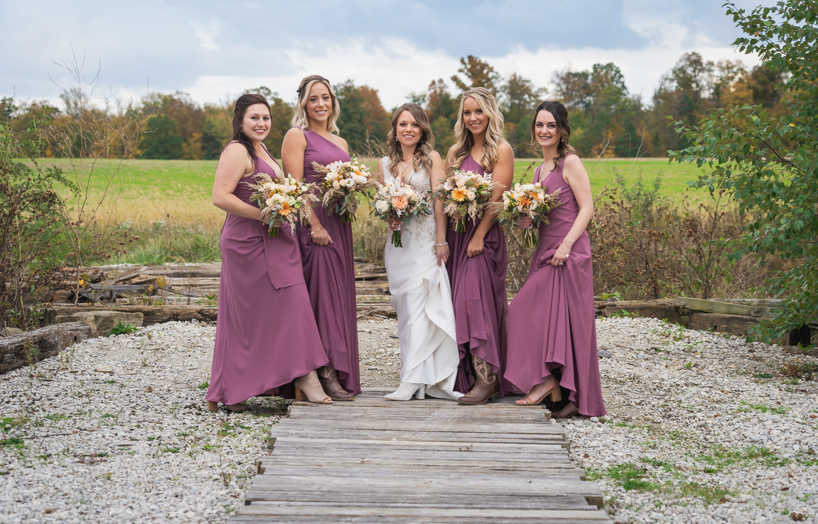 Bride with bridesmaids, bridal party portrait, fall wedding, outdoor wedding ceremony at White Birch Barn